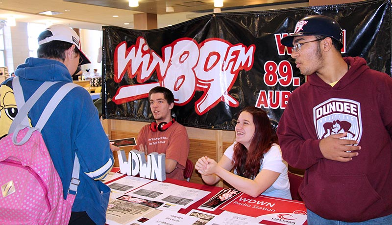 Students in the radio station booth