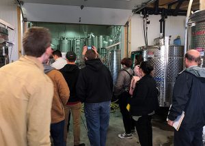 Students at the Buttonwood Grove Winery getting a tour of the facility