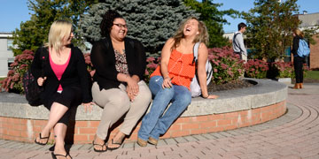 Students outside on campus enjoying a nice day