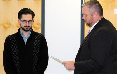 New Cayuga Community College Student Trustee Daniel Charles is sworn-in by Cayuga President Dr. Brian Durant at the November meeting of the College Board of Trustees.