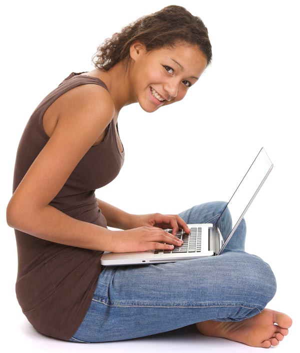 Female student on floor working on a laptop